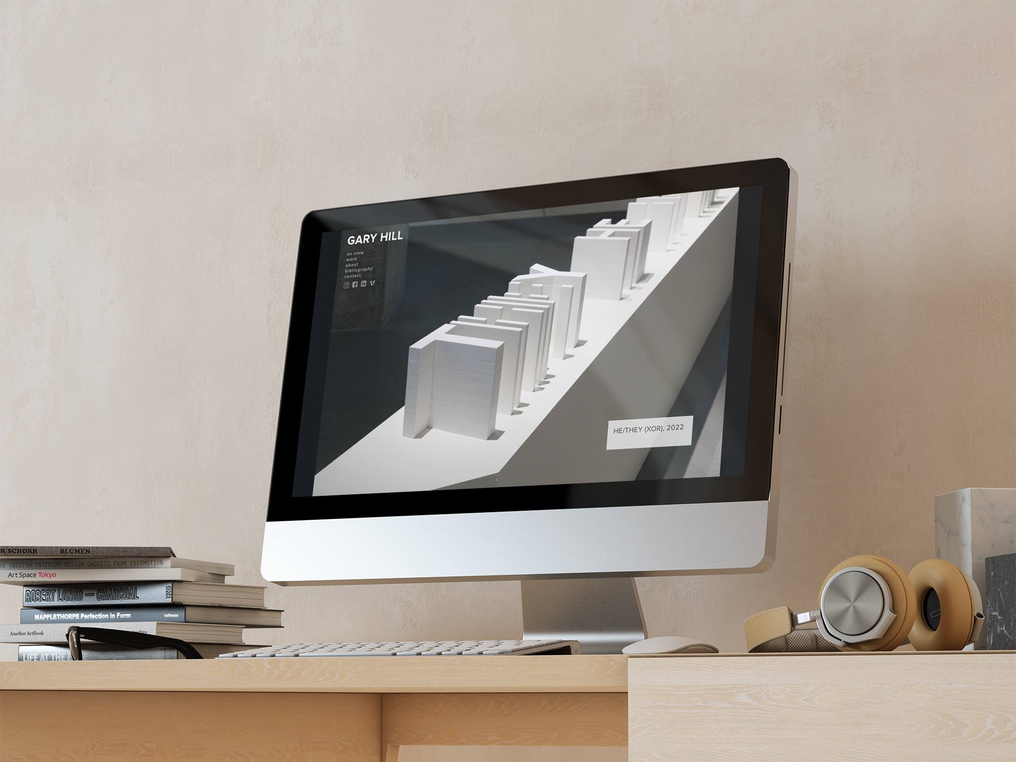 A computer on a desk with the gary hill home page